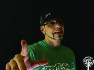 Jose Dominguez wearing a hat and glasses